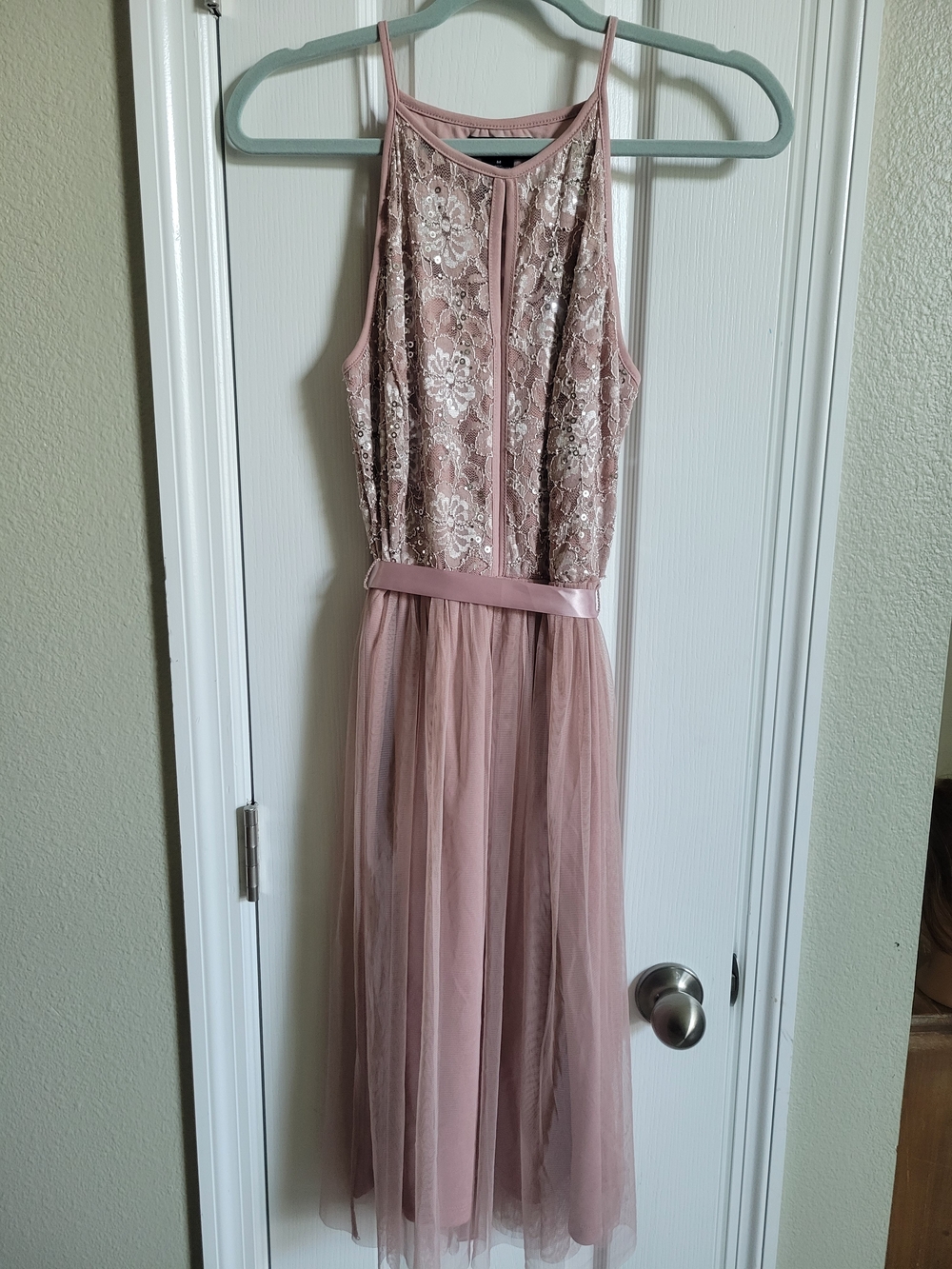 Candalite sleeveless special occasion dress in a soft mauve/rose pink shade.